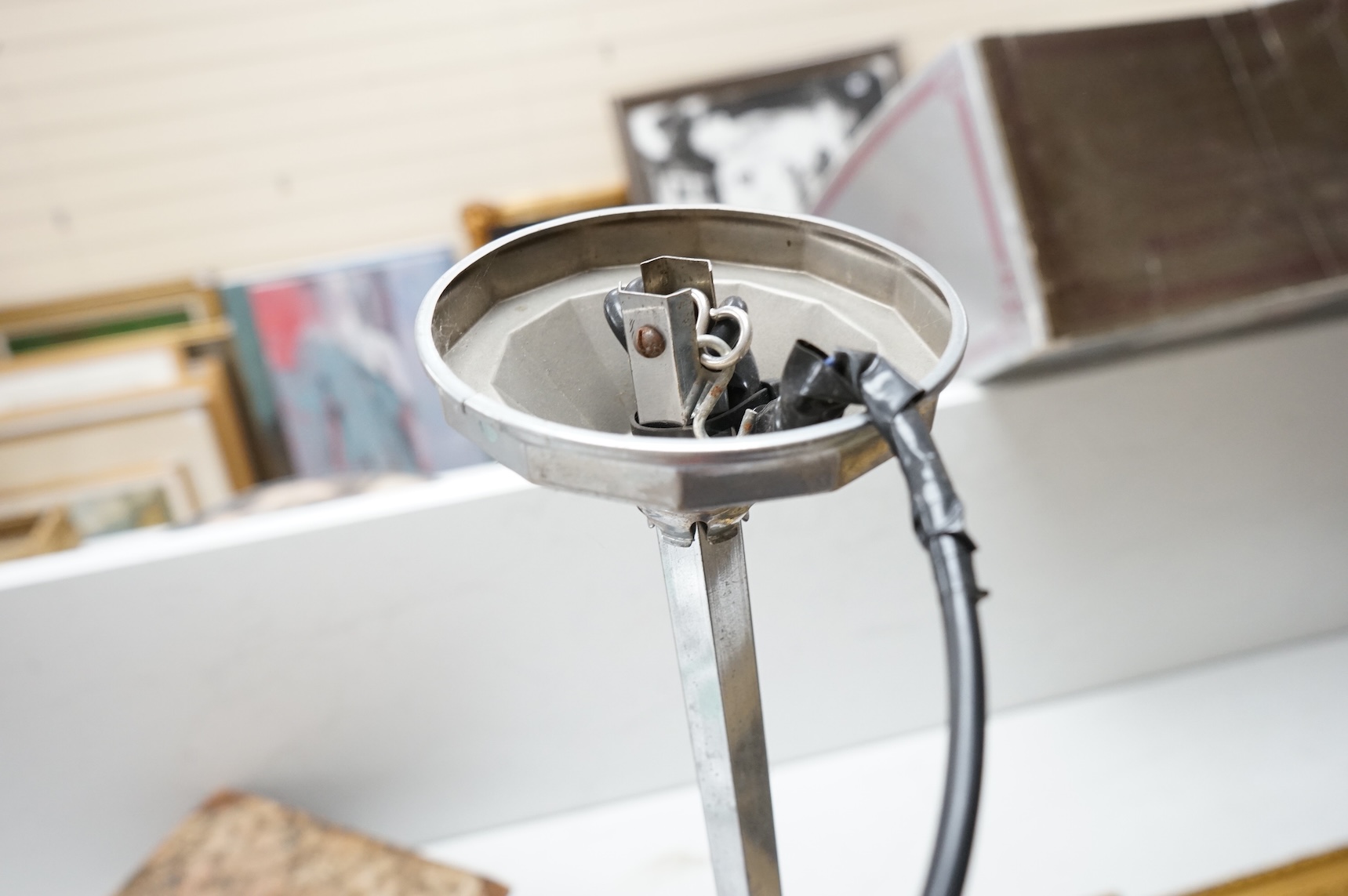 A French Art Deco chromed metal triple glass globed pendant ceiling light, 63cm high